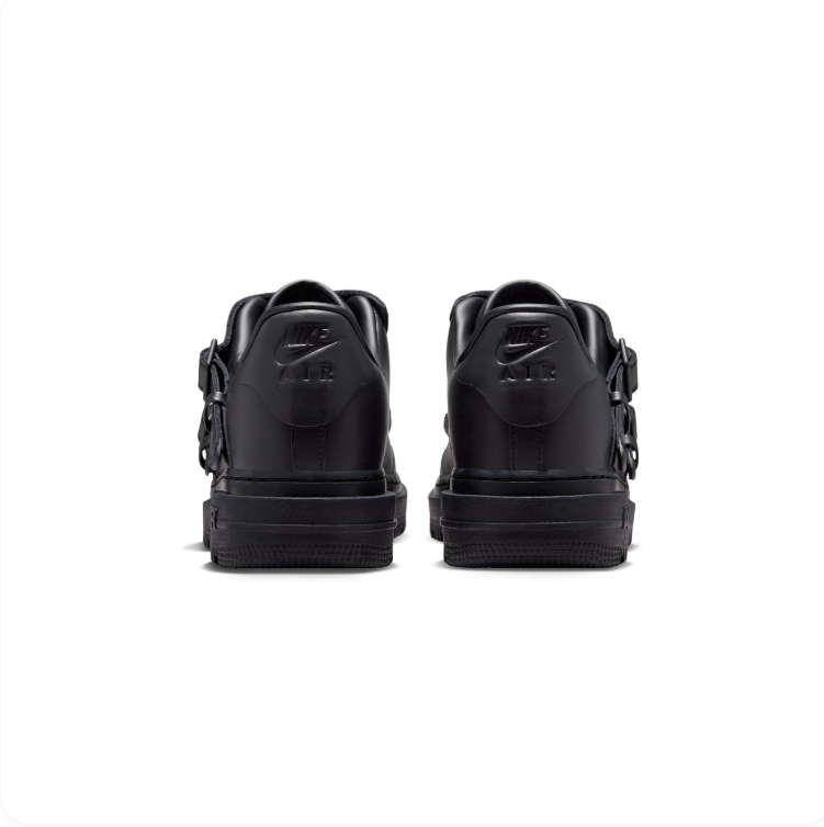 Nike Black Low-Top Sneakers with Buckled Shroud & Silver Swoosh